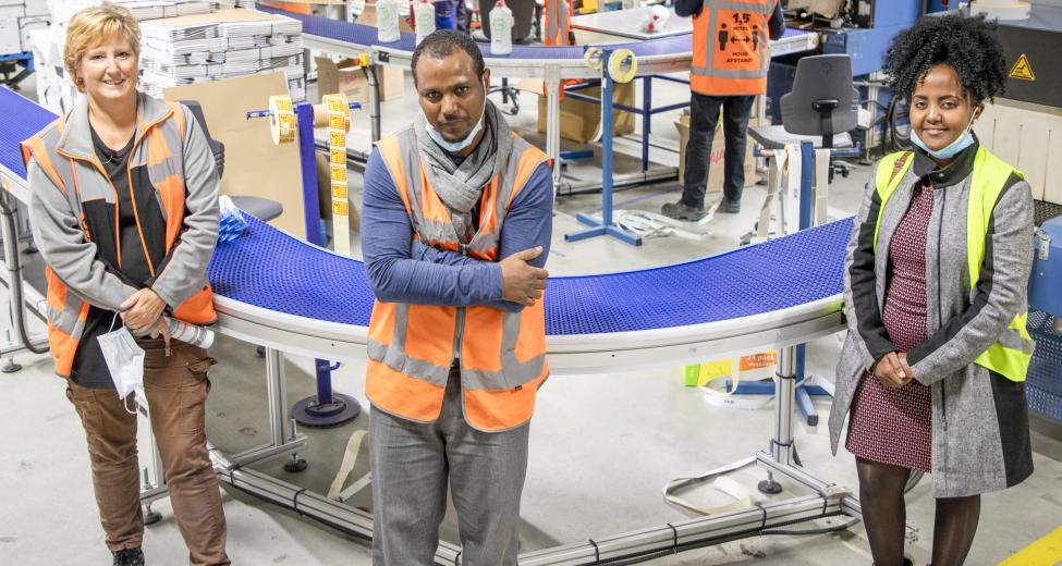 Medewerkers op de werkvloer